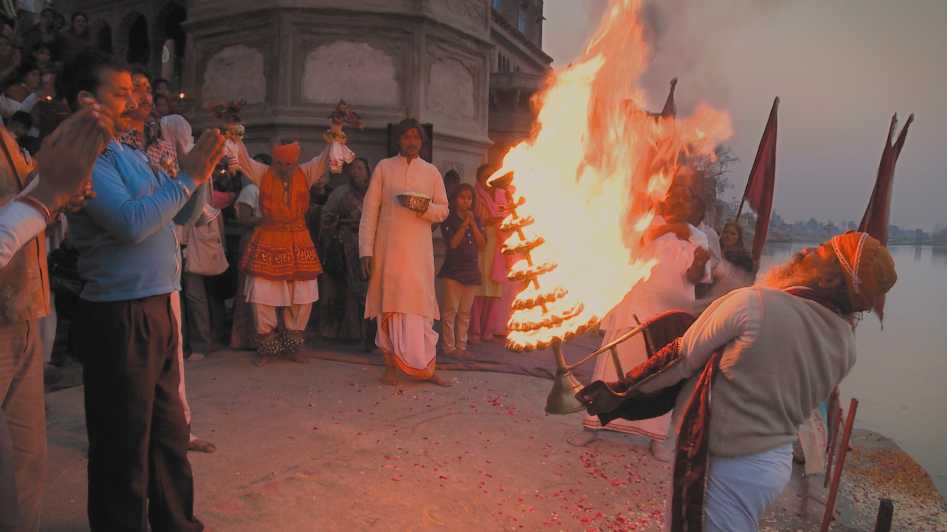 Marvel at an ancient fire ceremony. Yamuna arati, a daily worshiping of the sacred river. Keshi Ghat, Vrindavan, India. A still from the multi-award winning film 'Reconnection'.